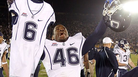 Connecticut linebacker Sio Moore carries the jersey of Jasper Howard after Connecticut defeated Notre Dame 33-30 in double overtime in an NCAA college football game in South Bend, Ind., Saturday, Nov. 21, 2009. Howard was stabbed to death earlier in the season. (AP Photo/Michael Conroy)