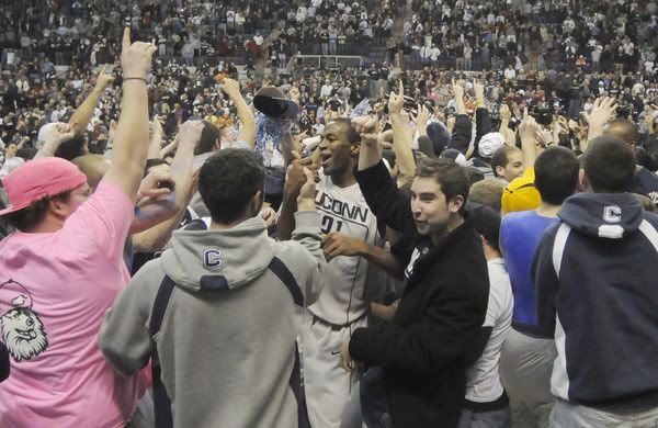 Stanley Robinson is mobbed by fans after UConn's 88-74 upset win over top-ranked Texas at Gampel Pavilion on Jan. 23, 2010 - Patrick Raycraft/Hartford Courant