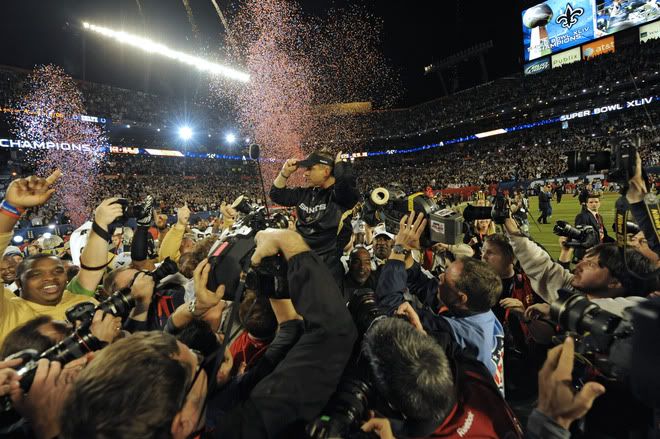 Head coach Sean Payton of the New Orleans Saints is hoisted after the Saints defeated the Indianapolis Colts during Super Bowl XLIV on February 7, 2010 at Sun Life Stadium in Miami Gardens, Florida. AFP PHOTO TIMOTHY A. CLARY (Photo credit should read TIMOTHY A. CLARY/AFP/Getty Images)