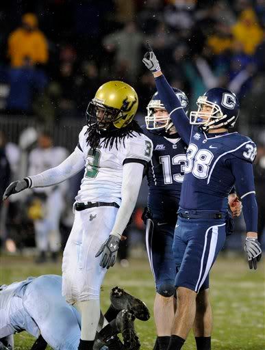 Connecticut kicker Dave Teggart, right, and South Florida's Jerome Murphy react to Teggart's 42 yard game-winning field goal with no time left on the clock in the fourth quarter of Connecticut's 29-27 victory over South Florida in their NCAA college football game in East Hartford, Conn., on Saturday, Dec. 5, 2009. (AP Photo/Fred Beckham)