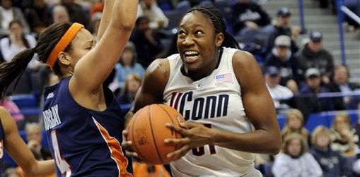 Connecticut's Tina Charles goes past Syracuse's Vionca Murray in the second half of an NCAA college Big East Championship quarterfinal women's basketball game in Hartford, Conn., Sunday, March 7, 2010. Connecticut won 77-41. (AP Photo/Bob Child)