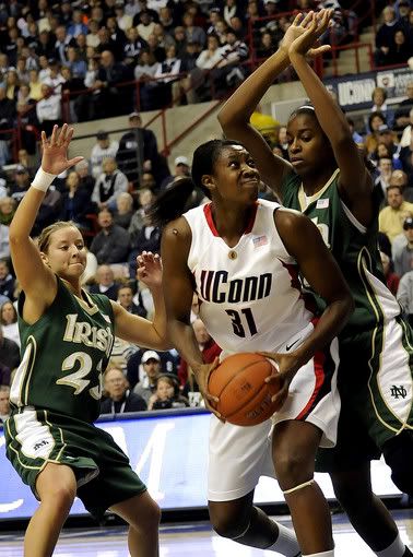 UConn center Tina Charles looks to shoot as Notre Dame's Melissa Lechlitner, left, and Devereaux Peters defend in the first half at Gampel Pavilion Storrs on Saturday, Jan. 16, 2010 - AP Photo