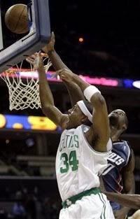 Boston Celtics guard Paul Pierce (34) shoots over Charlotte Bobcats forward Emeka Okafor (50) during the first half of the Celtics' 89-84 win in an NBA basketball game in Charlotte, N.C. - AP Photo