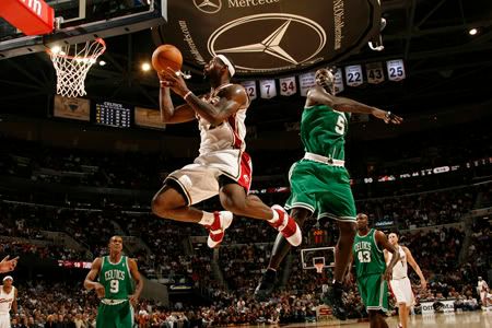 James buzzes past Garnett.  Getty Photo.