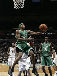 Rajon Rondo drives to the hoop against the Timberwolves.  Getty Photo.  