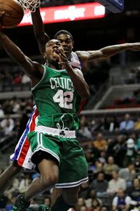 Tony Allen goes in for a layup against Amir Johnson. AP Photo