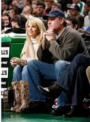 Curt Schilling wearing his 2004 World Series ring and his wife, Shonda, looking good courtside. - Getty Photo