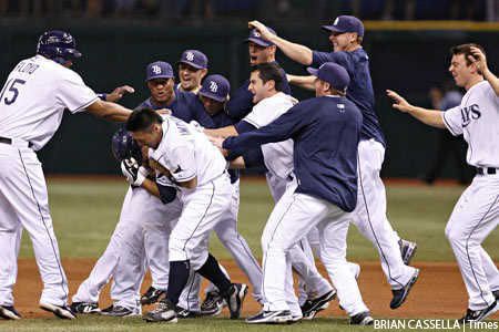 The Rays celebrate their 2-1 walk-off win over the Red Sox
