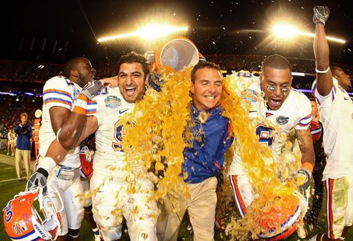 Head coach Urban Meyer of the Florida Gators gets gatorade dumped on him by his teammates towards the end of the game against the Oklahoma Sooners in the FedEx BCS National Championship Game at Dolphin Stadium on January 8, 2009 in Miami, Florida. The Gators wons the game by a score of 24-14. (Photo by Donald Miralle/Getty Images)