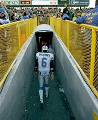 Detroit Lions quarterback Dan Orlovsky (6) walks off the field after the second half of an NFL football game against the Green Bay Packers - AP Photo