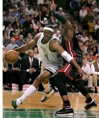 Celtics captain Paul Pierce goes around the Heats Dwayne Wade