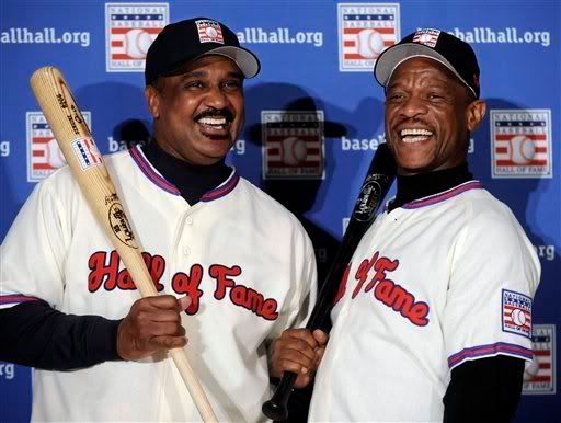Former Boston Red Sox outfielder Jim Rice (L) and former Oakland Athletics outfielder Rickey Henderson laugh together at a news conference after their election to the National Baseball Hall of Fame - AP Photo