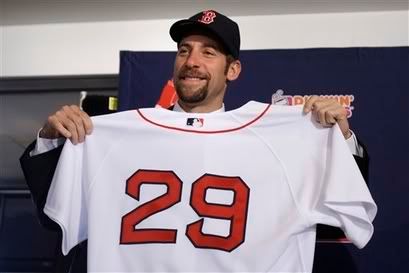 New Boston Red Sox pitcher John Smoltz holds up his jersey during a news conference at Fenway Park - AP Photo