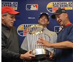 Larry Lucchino, Theo Epstein and Terry Francona with World Series Trophy