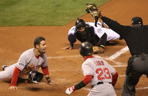 Mike Lowell safe at the plate in Game 4 - Getty Images