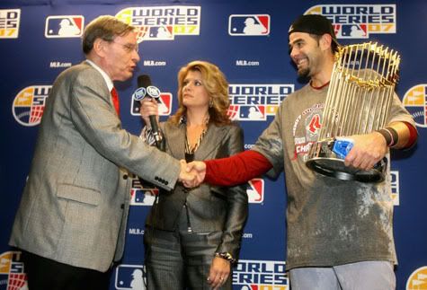 Mike Lowell accepting his World Series MVP - Getty Images