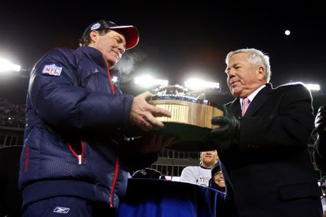 Patriots owner Robert Kraft hands head coach Bill Belichick the Lamar Hunt Trophy - Getty Photo
