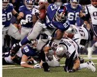 Bruschi tries to stop Jacobs -AP Photo