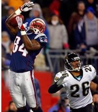 Ben Watson catches one of his two TD passes in the 31-20 win over Jacksonville - Getty Photo