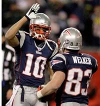 Jabar Gaffney congratulates Wes Welker on his TD catch - AP Photo