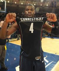 Connecticut guard Jeff Adrien displays his jersey following his team's 69-61 victory over Notre Dame in a NCAA college basketball game Saturday Jan. 24, 2009 in South Bend, Ind. Adrien scored 12 points and had 19 rebounds. (AP Photo/Joe Raymond)
