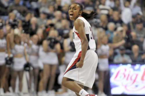 Renee Montgomery celebrates after hitting a three-pointer in the first half during the Huskies' 106-78 victory over Oklahoma Sunday night at Gampel Pavilion - Hartford Courant Photo