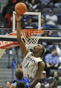 Connecticut's Hasheem Thabeet, top, blocks a shot by Seton Hall's Jordan Theodore in the first half of the Big East basketball game  - AP Photo/Jessica Hill