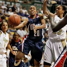 Connecticut's Renee Montgomery splits the South Florida defense, including Jessica Lawson (23) and Jazmine Sepulveda (4) during the second half - AP Photo
