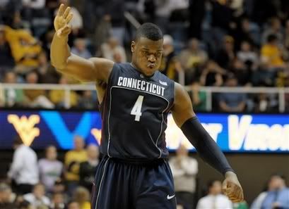 Connecticut forward Jeff Adrien (4) celebrates with less than a minute to play against West Virginia during an NCAA college basketball game - AP Photo