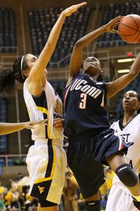 West Virginia's Liz Repella tries to block at shot by Connecticut's Tiffany Hayes during the first half - AP Photo 