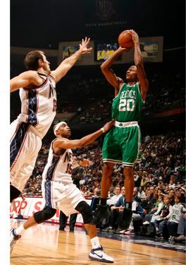 Ray Allen shoots over the Nets defense.  Getty Photo