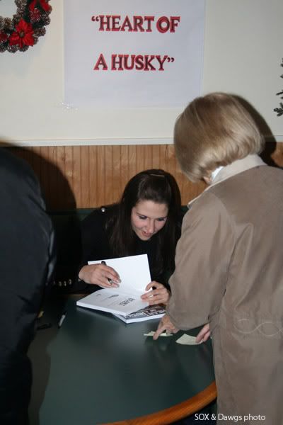 Mel Thomas signs copies of her book for fans in East Haven, CT