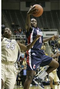 Tina Charles going up for 2 - AP Photo